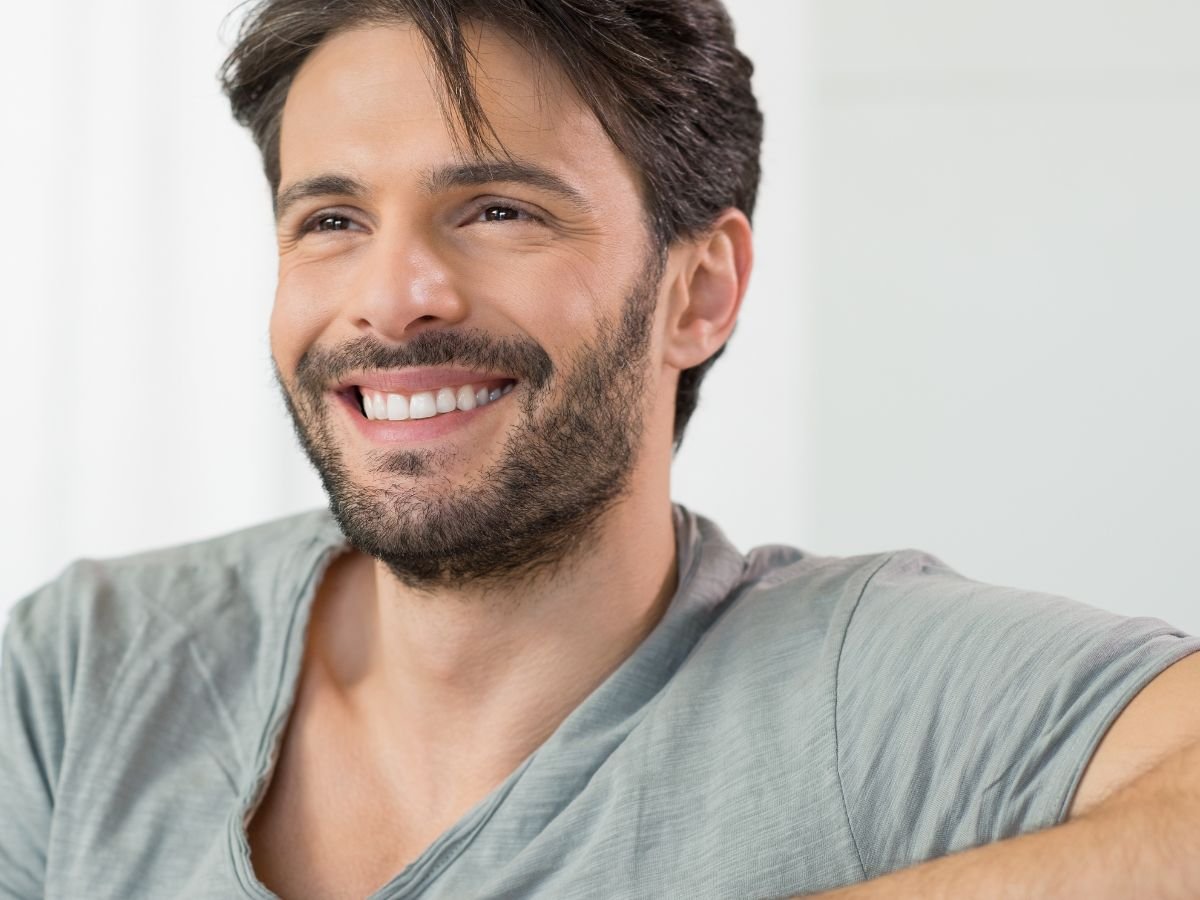 Man confidently smiling after his dental veneer in Odenton MD